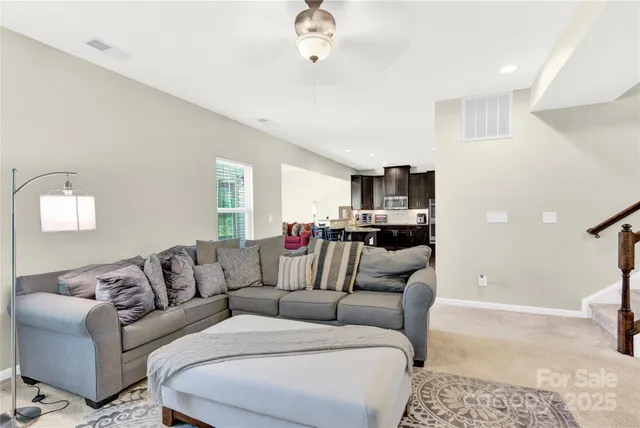 a living room with furniture and a couch