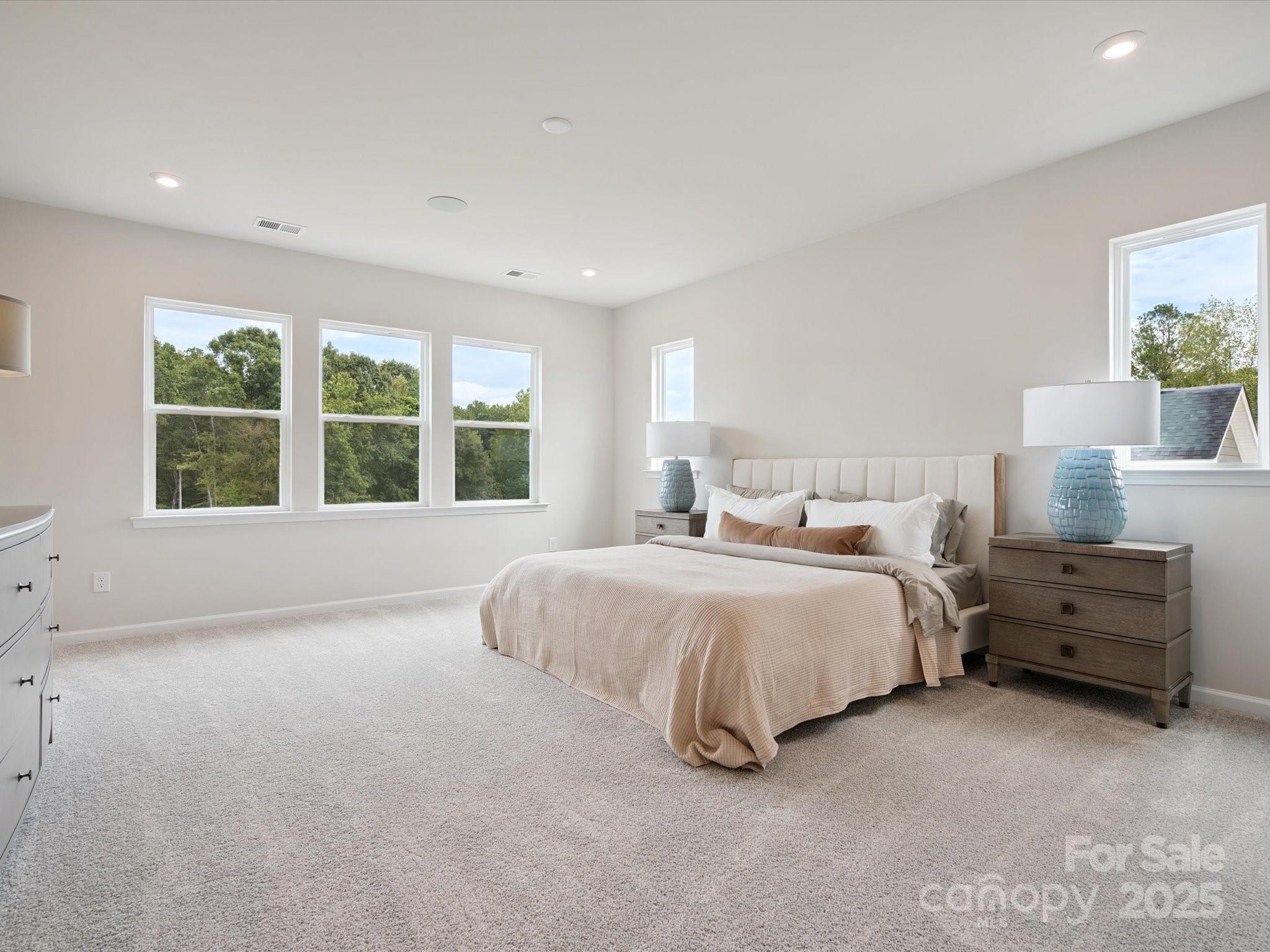619 Webster Lane Cramerton, NC 28032 - Photo 12 of 20 a spacious bedroom with a bed and a large window