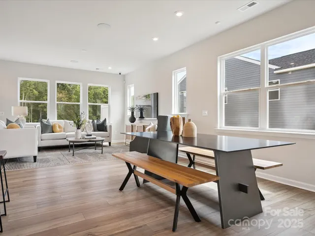 a living room with furniture a window and a table