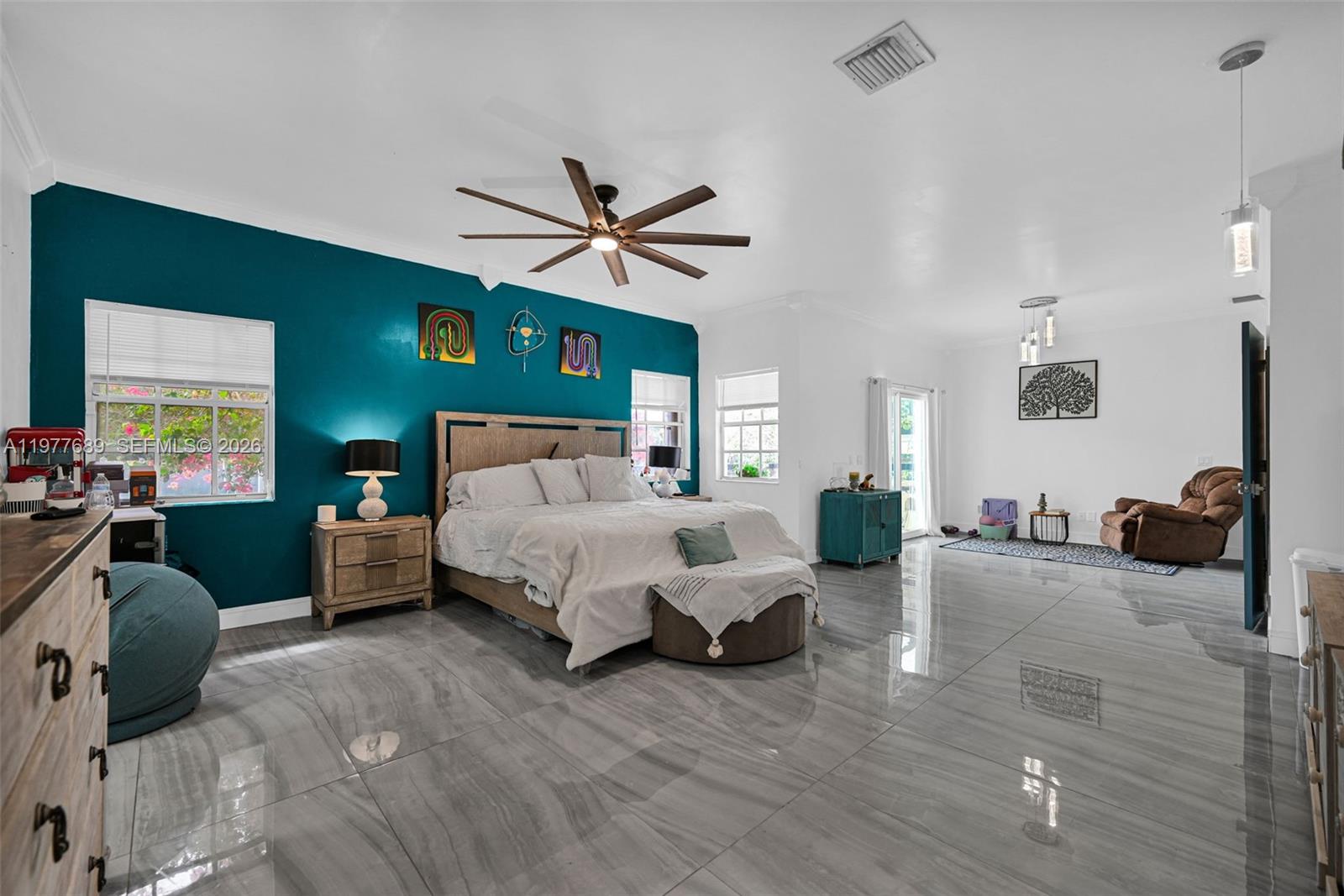 18950 Southwest 50th Street Southwest Ranches, FL 33332 - Photo 13 of 63 a bedroom with a bed couch and a large window