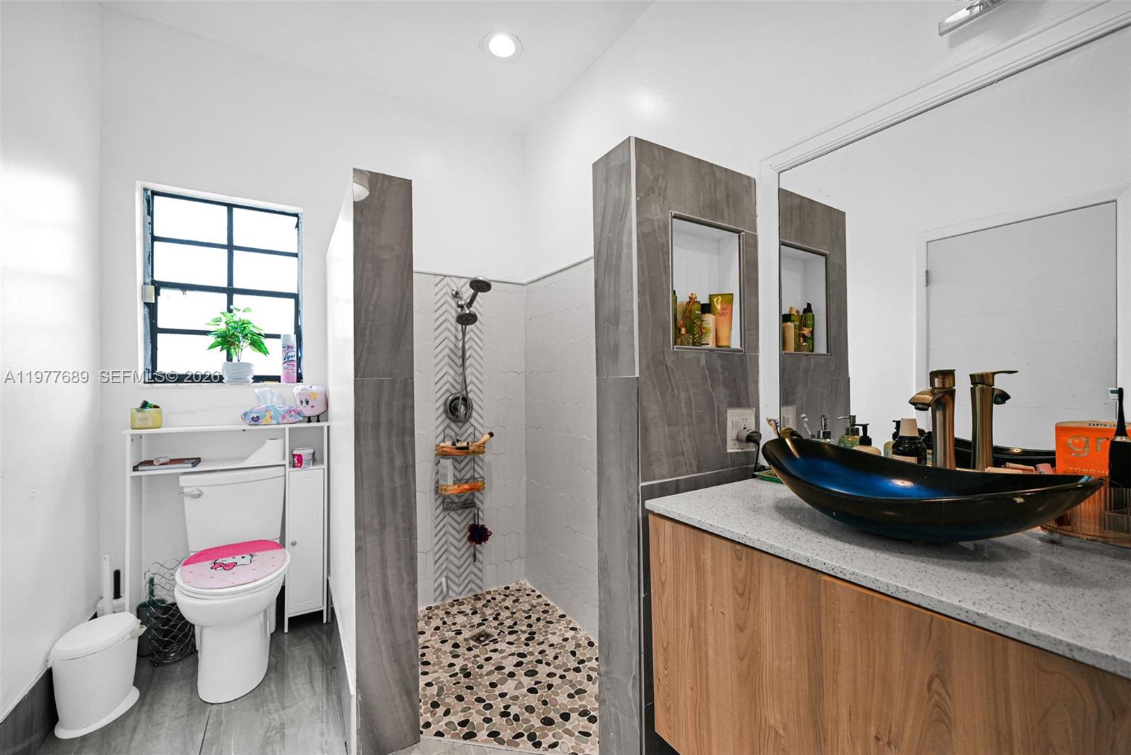 18950 Southwest 50th Street Southwest Ranches, FL 33332 - Photo 29 of 63 a bathroom with a sink toilet and shower