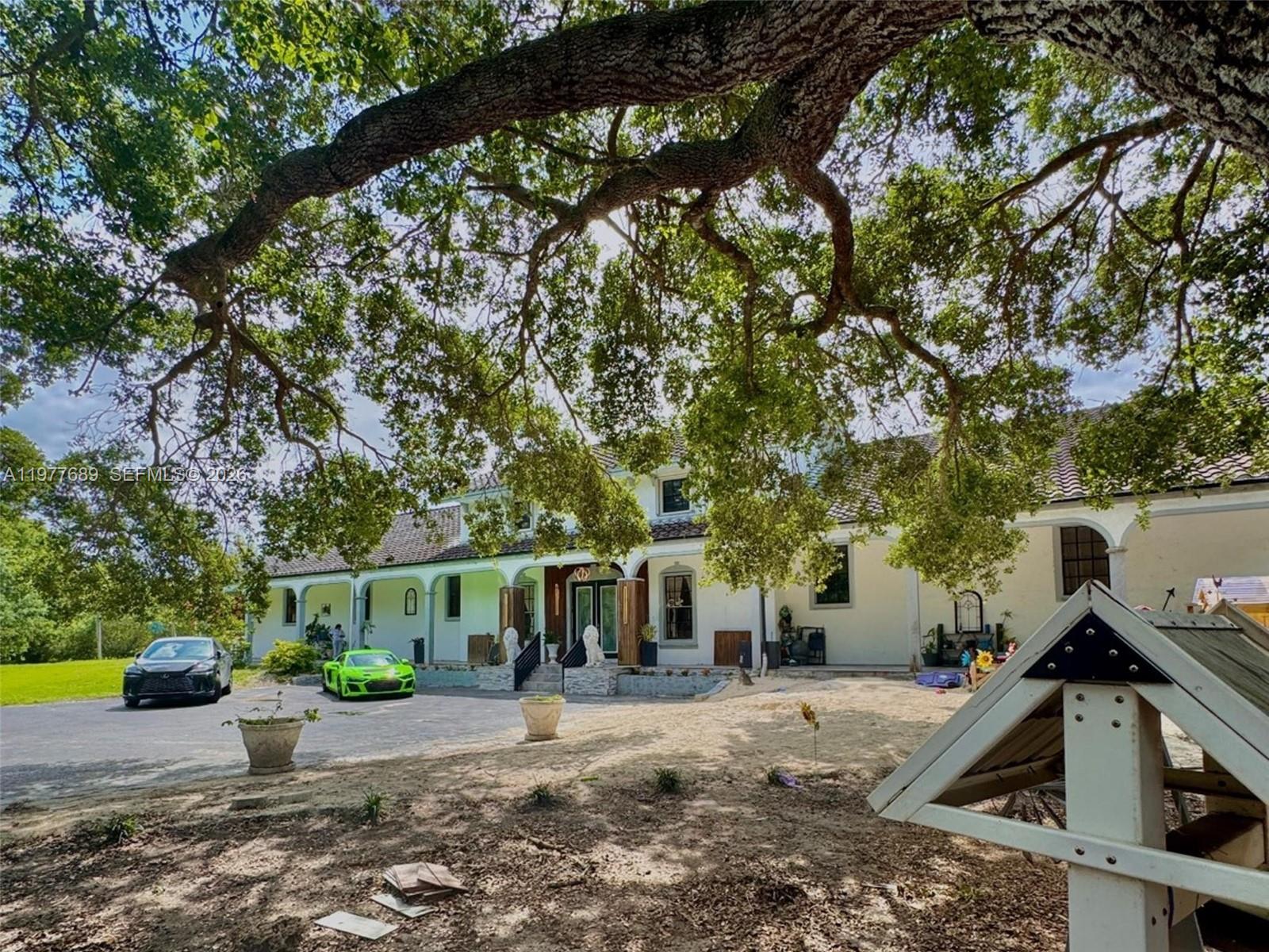 18950 Southwest 50th Street Southwest Ranches, FL 33332 - Photo 3 of 63 a view of a house with a patio