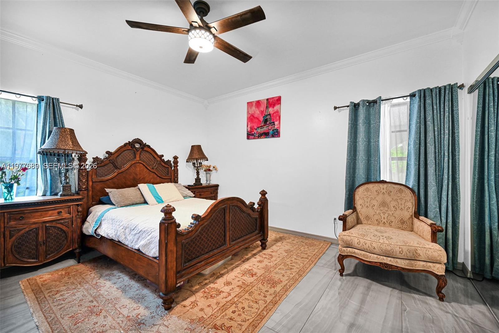 18950 Southwest 50th Street Southwest Ranches, FL 33332 - Photo 34 of 63 a bedroom with a bed and wooden floor