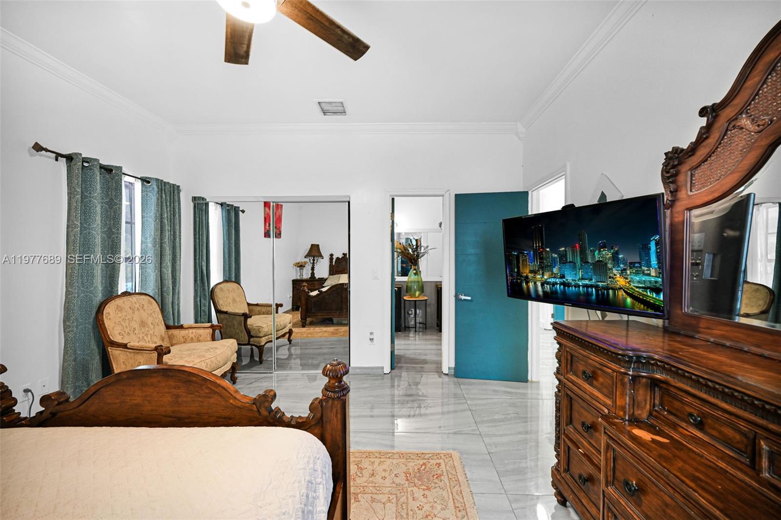 18950 Southwest 50th Street Southwest Ranches, FL 33332 - Photo 36 of 63 a living room with furniture and a flat screen tv