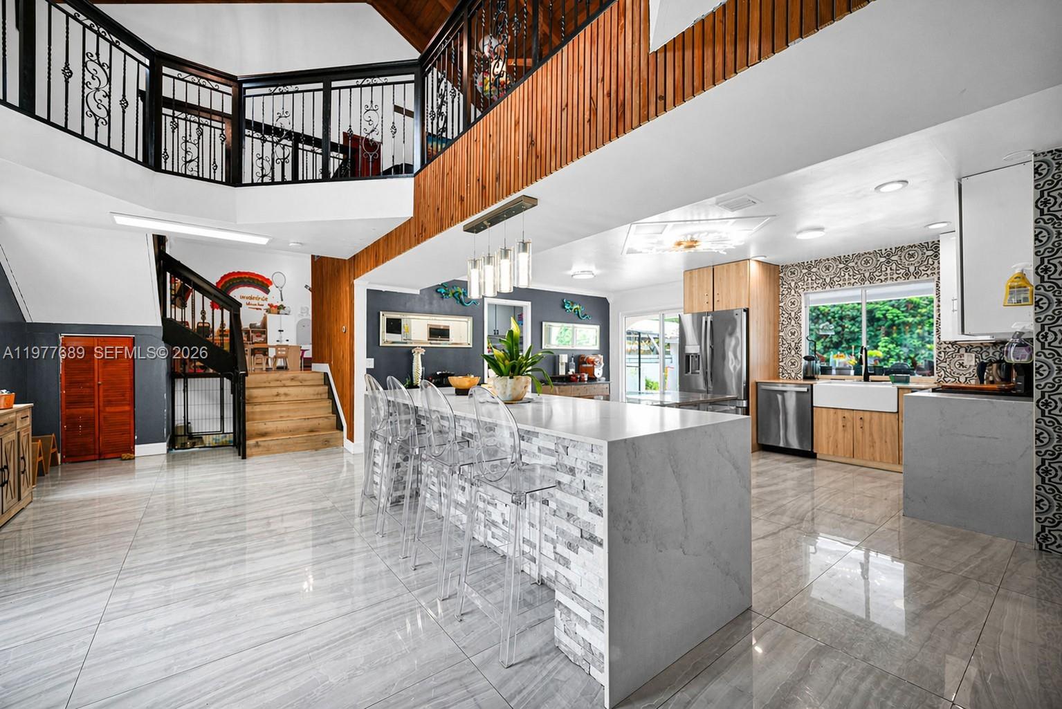 18950 Southwest 50th Street Southwest Ranches, FL 33332 - Photo 4 of 63 a living room with furniture and a large window