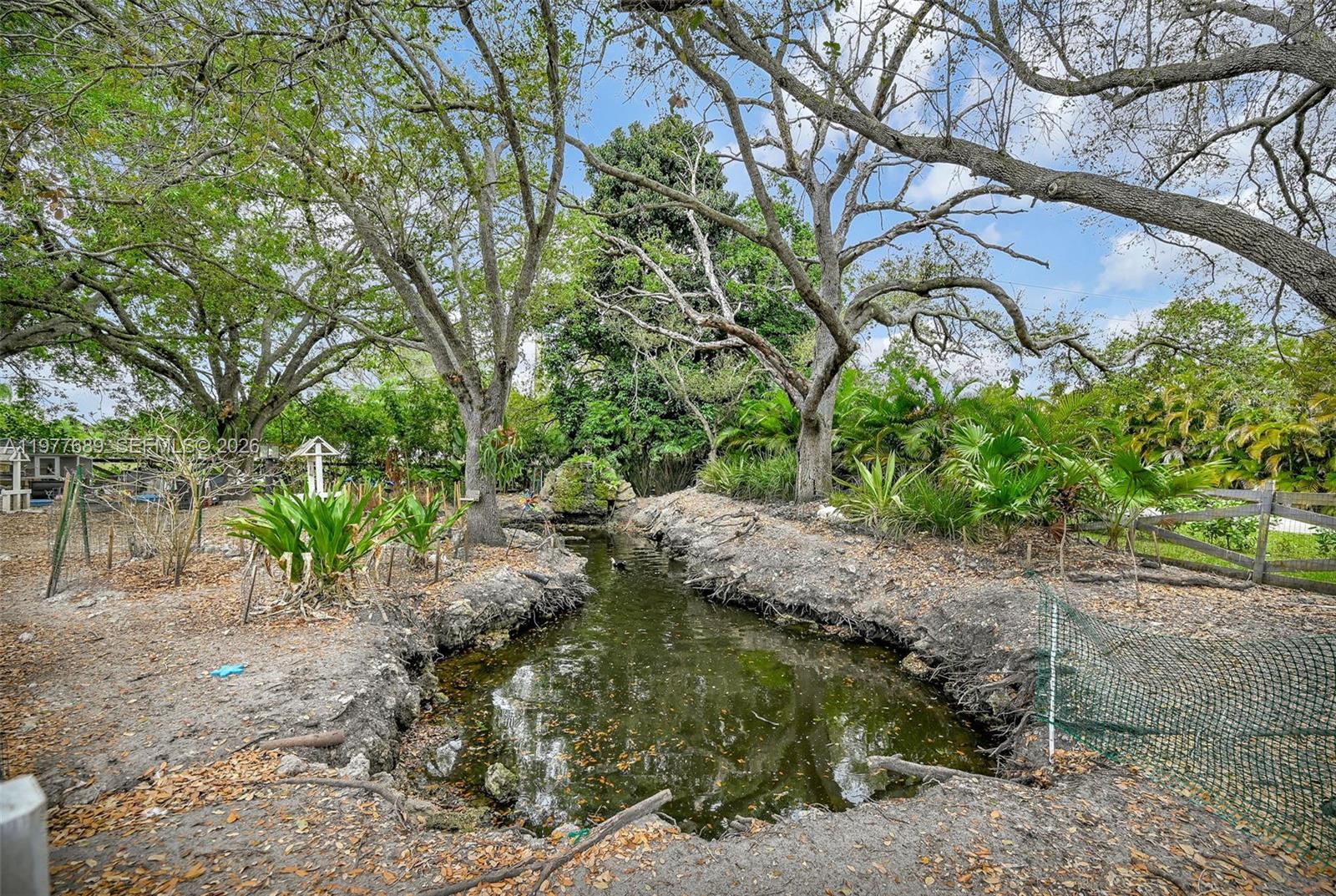18950 Southwest 50th Street Southwest Ranches, FL 33332 - Photo 47 of 63 a backyard of a house with lots of green space