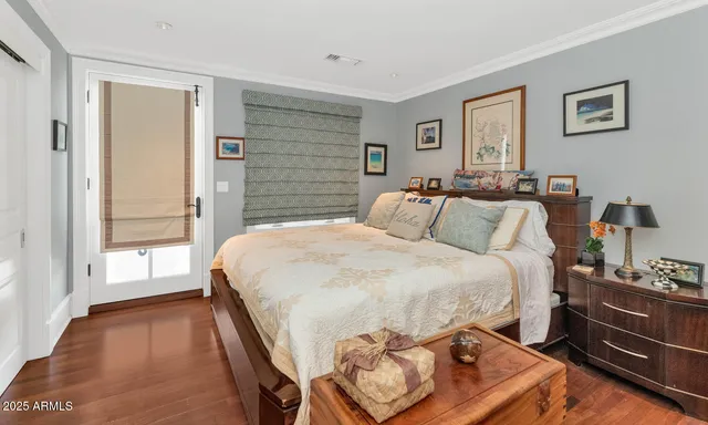 a bathroom with a granite countertop toilet sink and mirror