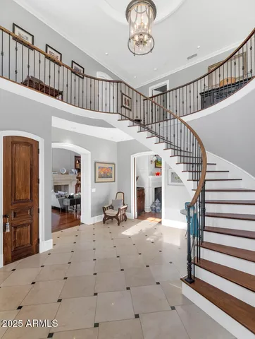 a view of entryway livingroom and hall with wooden floor