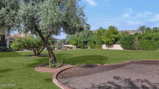 an aerial view of a house with garden space and street view