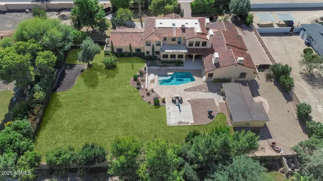 an aerial view of residential houses and outdoor space
