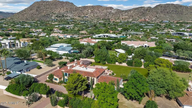 an aerial view of a house with mountain view
