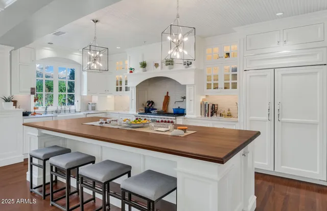 a kitchen with a sink cabinets and window
