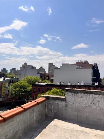 a view of swimming pool with a lounge chair