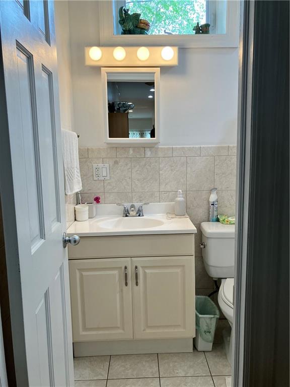 55 4th Avenue Brooklyn, NY 11217 - Photo 10 of 33 a bathroom with a sink vanity and toilet