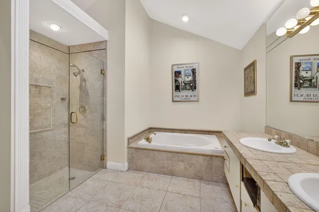 a bathroom with a glass shower door