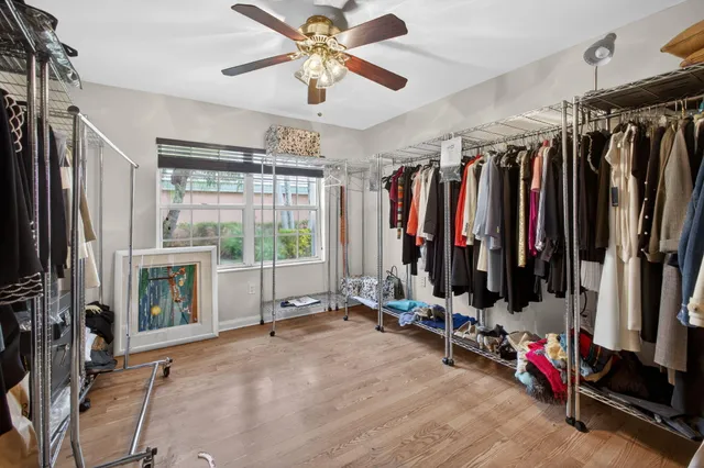 a building outdoor space with patio furniture and potted plants