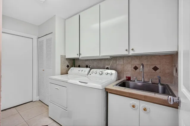 a view of a backyard with sitting area