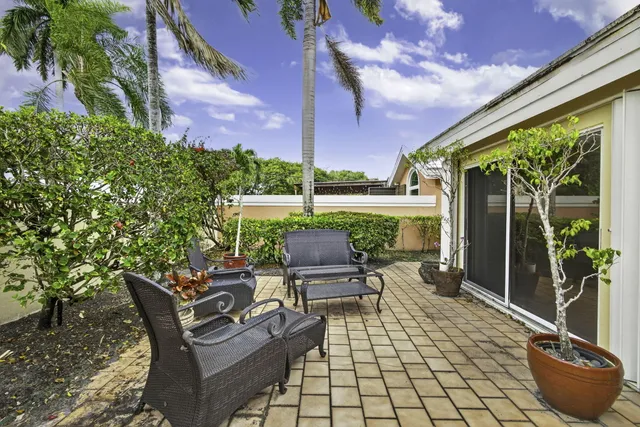 an aerial view of residential houses with outdoor space and river
