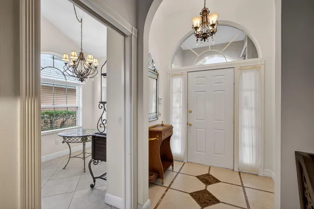 a living room with furniture a rug and a flat screen tv