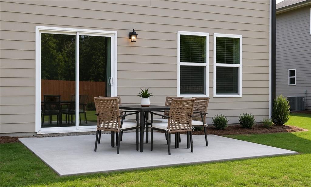 204 Paisley Way Locust Grove, GA 30248 - Photo 28 of 29 a view of a house with a backyard and sitting area