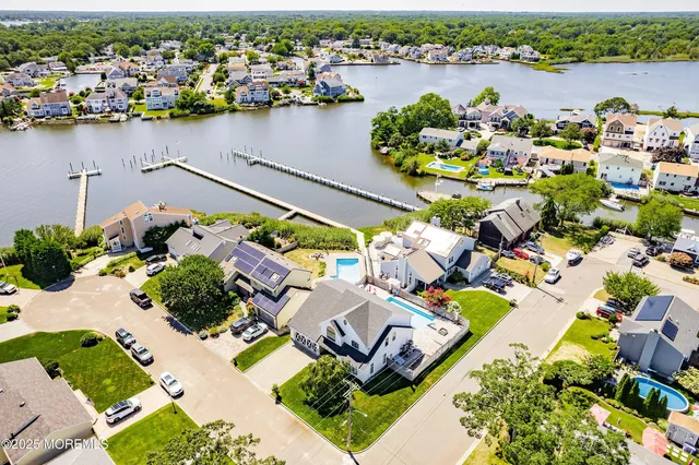 an aerial view of a house with outdoor space