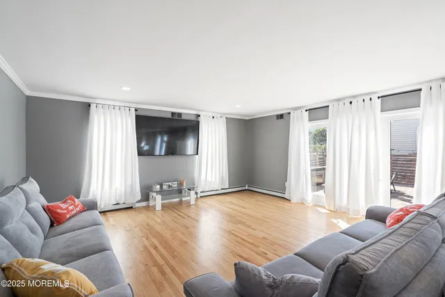a living room with furniture and white walls