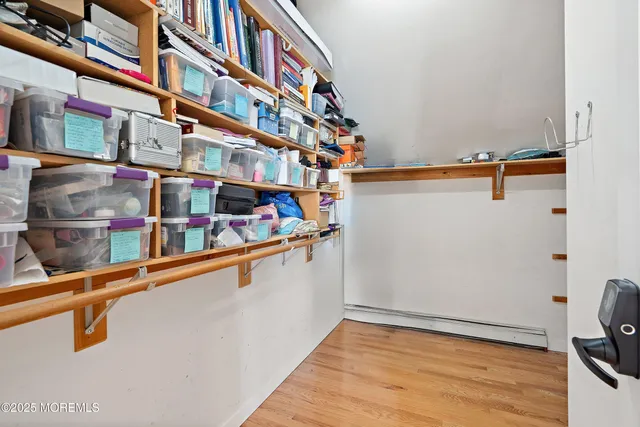 a room with a rug and a fireplace