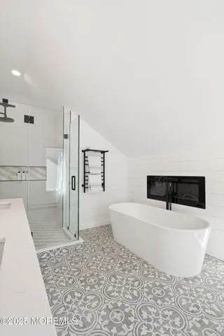 a wooden pier with boats and lake