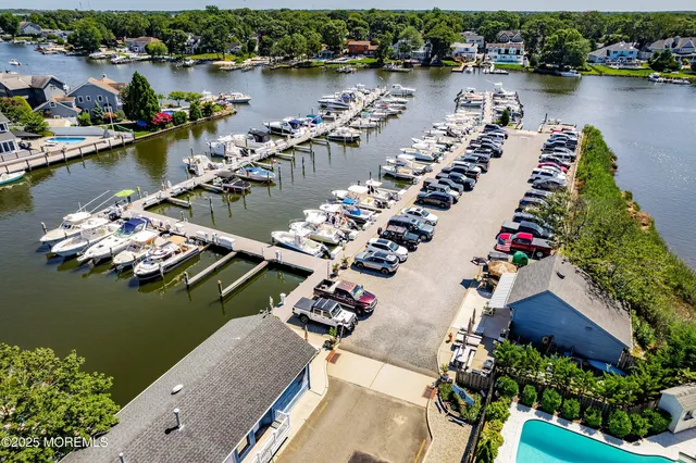 an aerial view of a house with a lake view