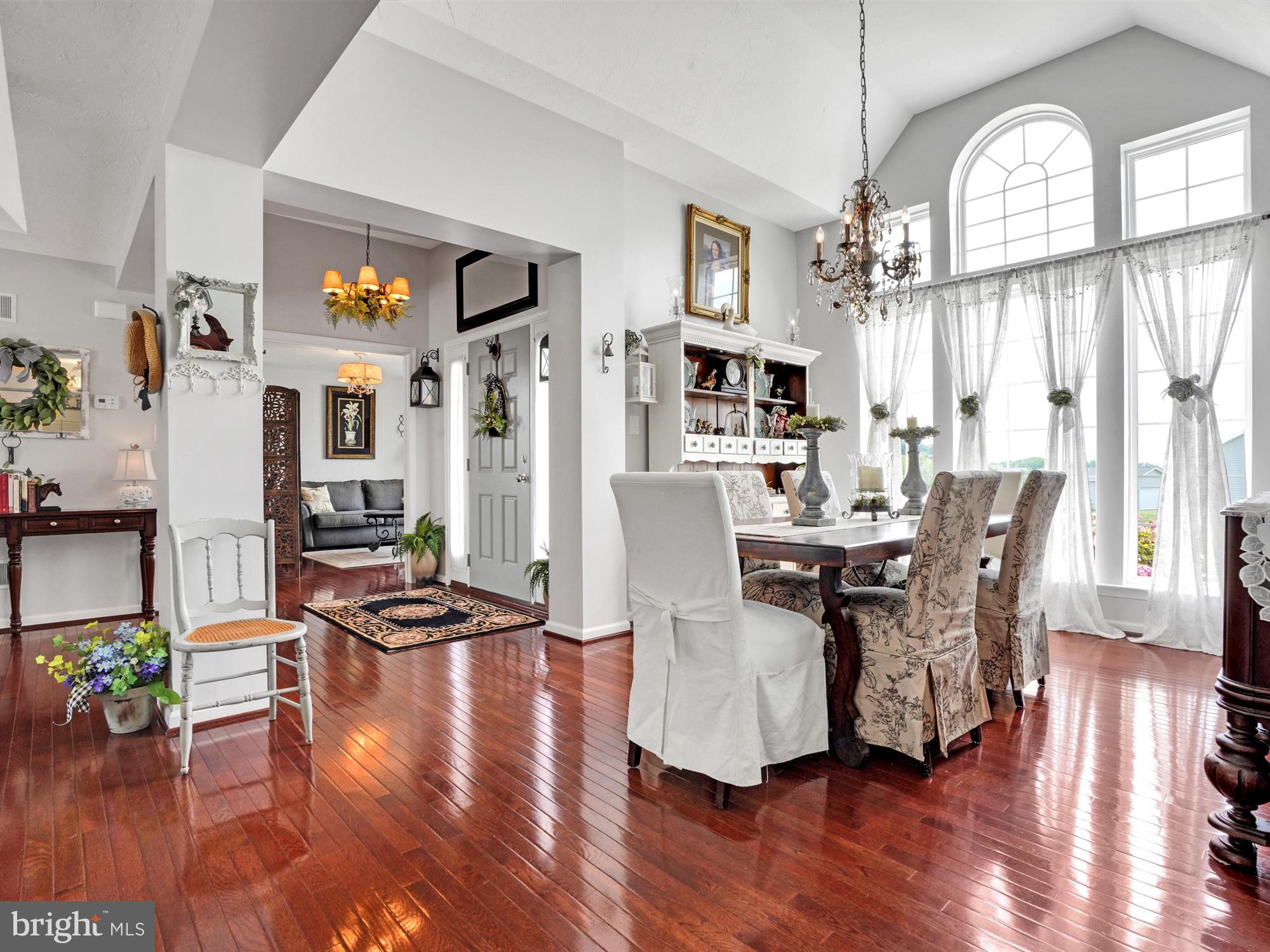 1214 Bair Road Hanover, PA 17331 - Photo 12 of 43 a view of a dining room with furniture a chandelier and wooden floor