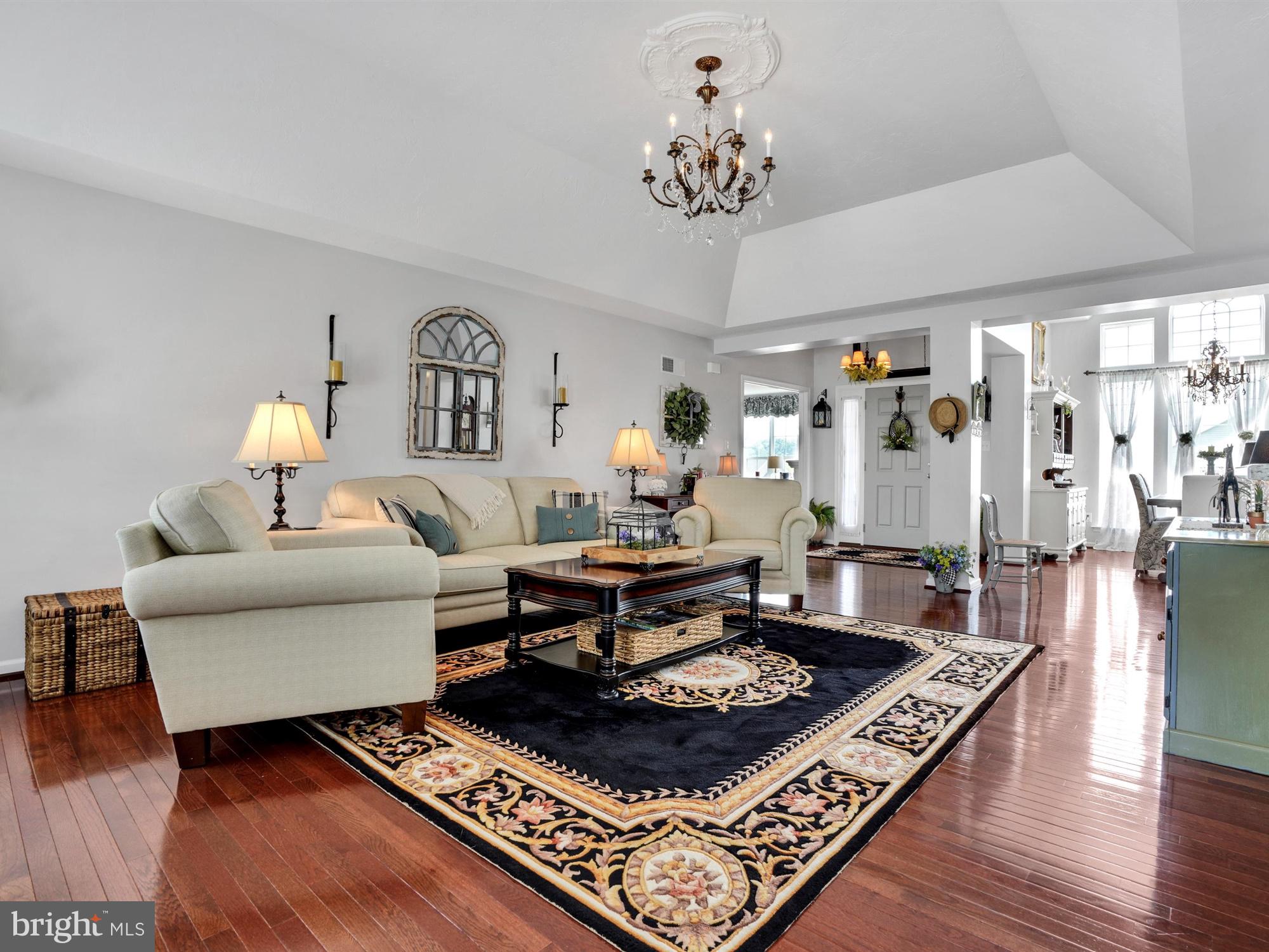 1214 Bair Road Hanover, PA 17331 - Photo 14 of 43 a living room with furniture a rug and a chandelier