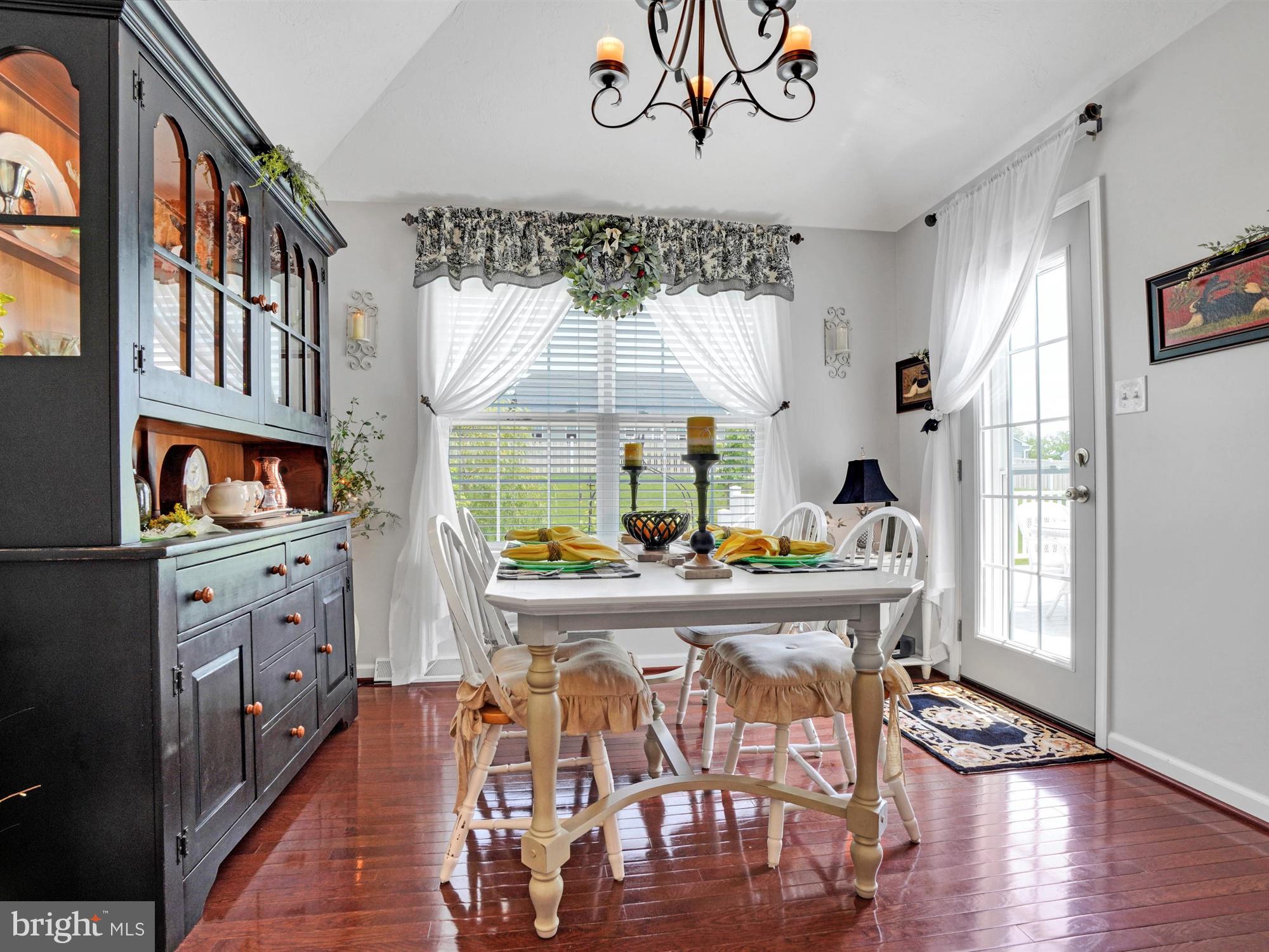 1214 Bair Road Hanover, PA 17331 - Photo 19 of 43 a view of a dining room with furniture window and wooden floor