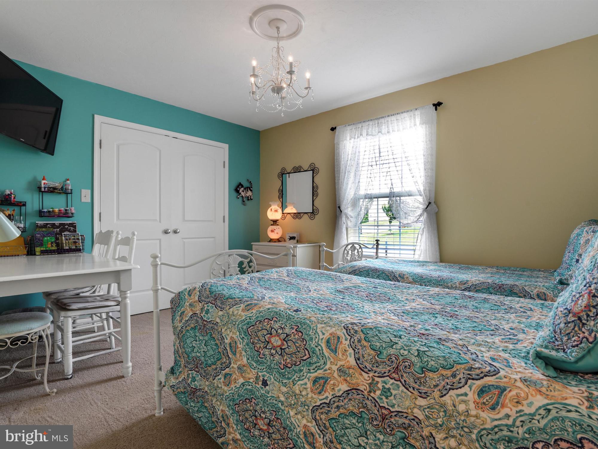 1214 Bair Road Hanover, PA 17331 - Photo 26 of 43 a bedroom with a bed and a chandelier