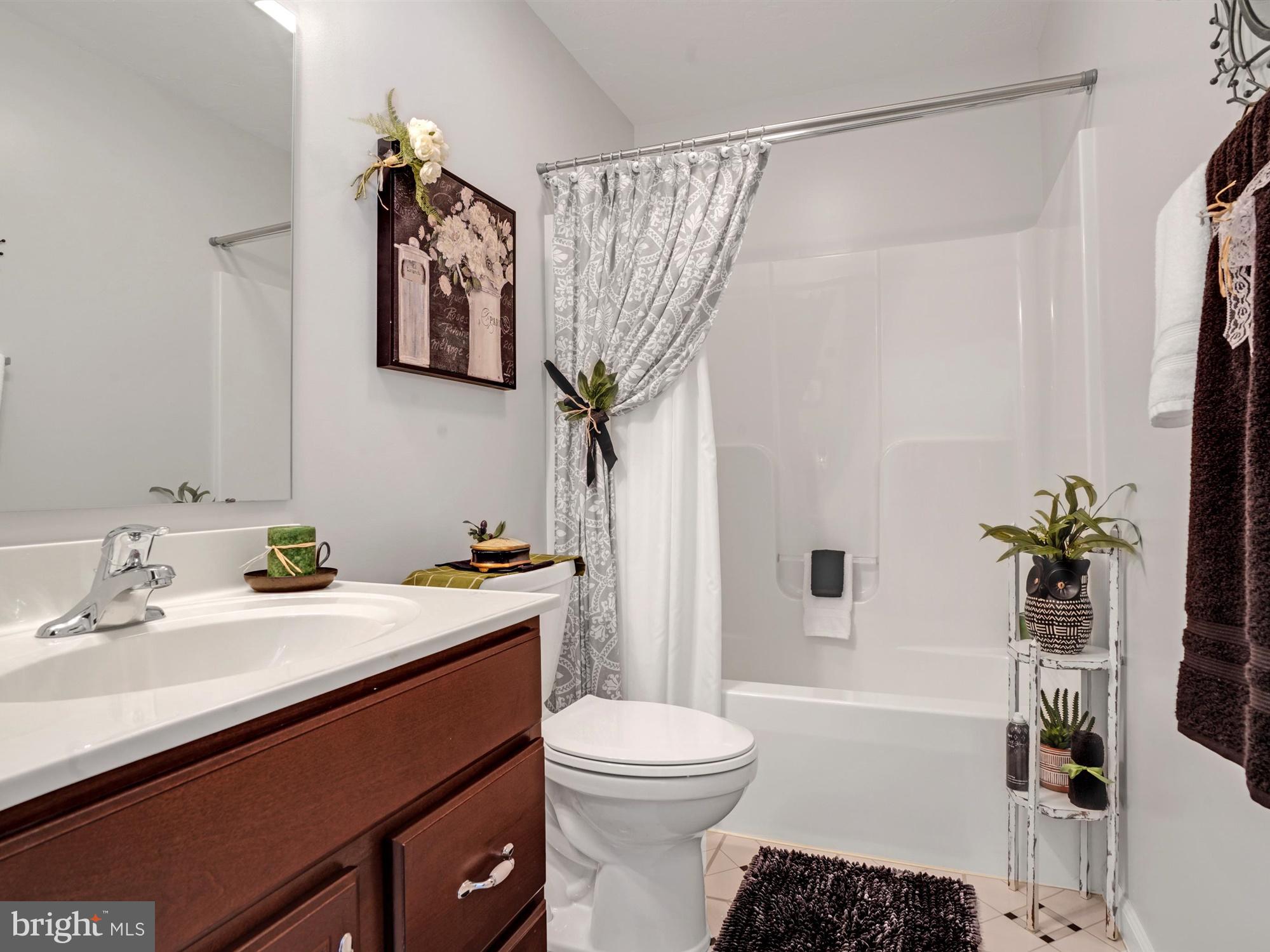 1214 Bair Road Hanover, PA 17331 - Photo 27 of 43 a bathroom with a sink a toilet a mirror a vanity and shower