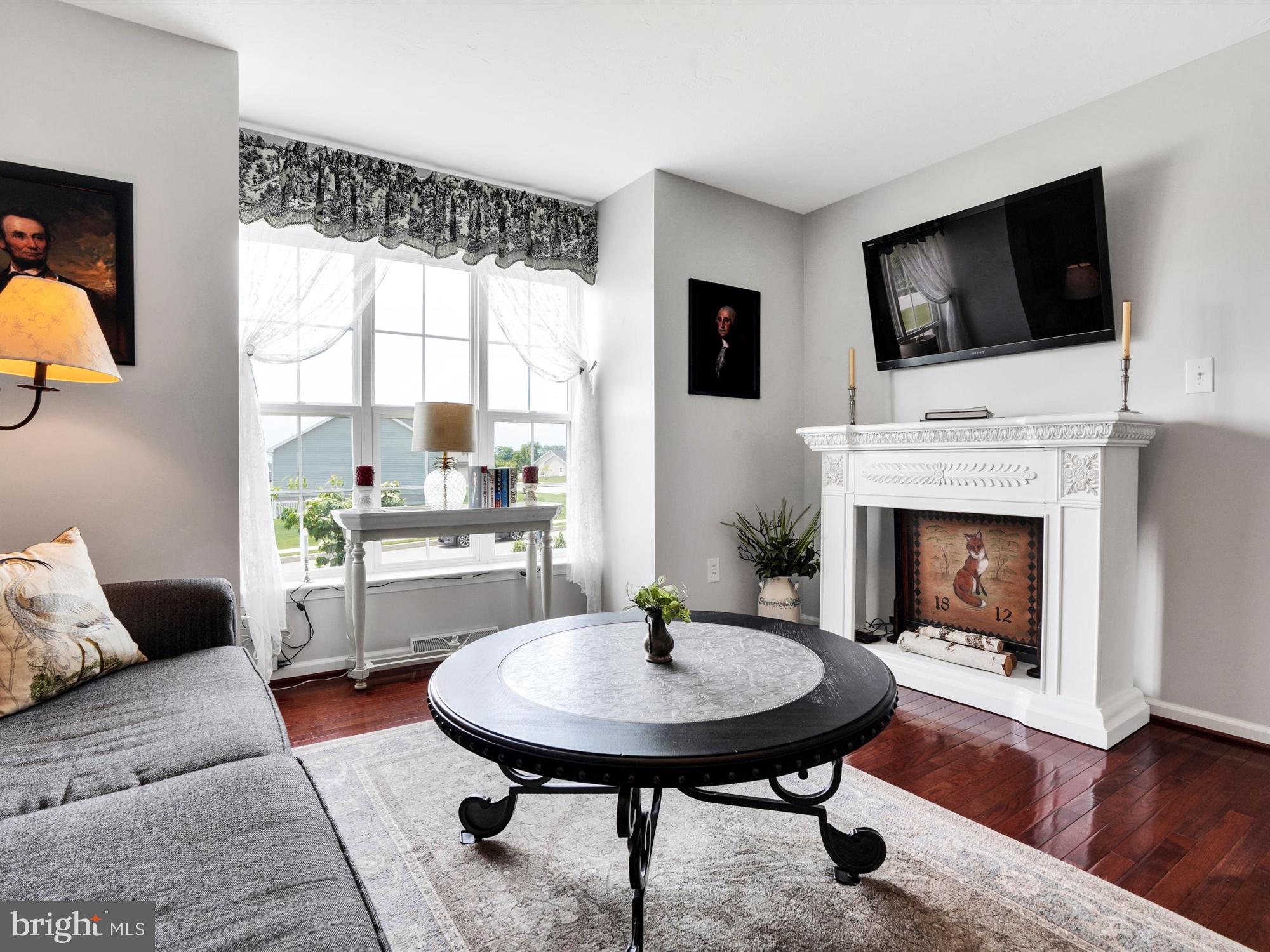 1214 Bair Road Hanover, PA 17331 - Photo 10 of 43 a living room with furniture a flat screen tv and a fireplace