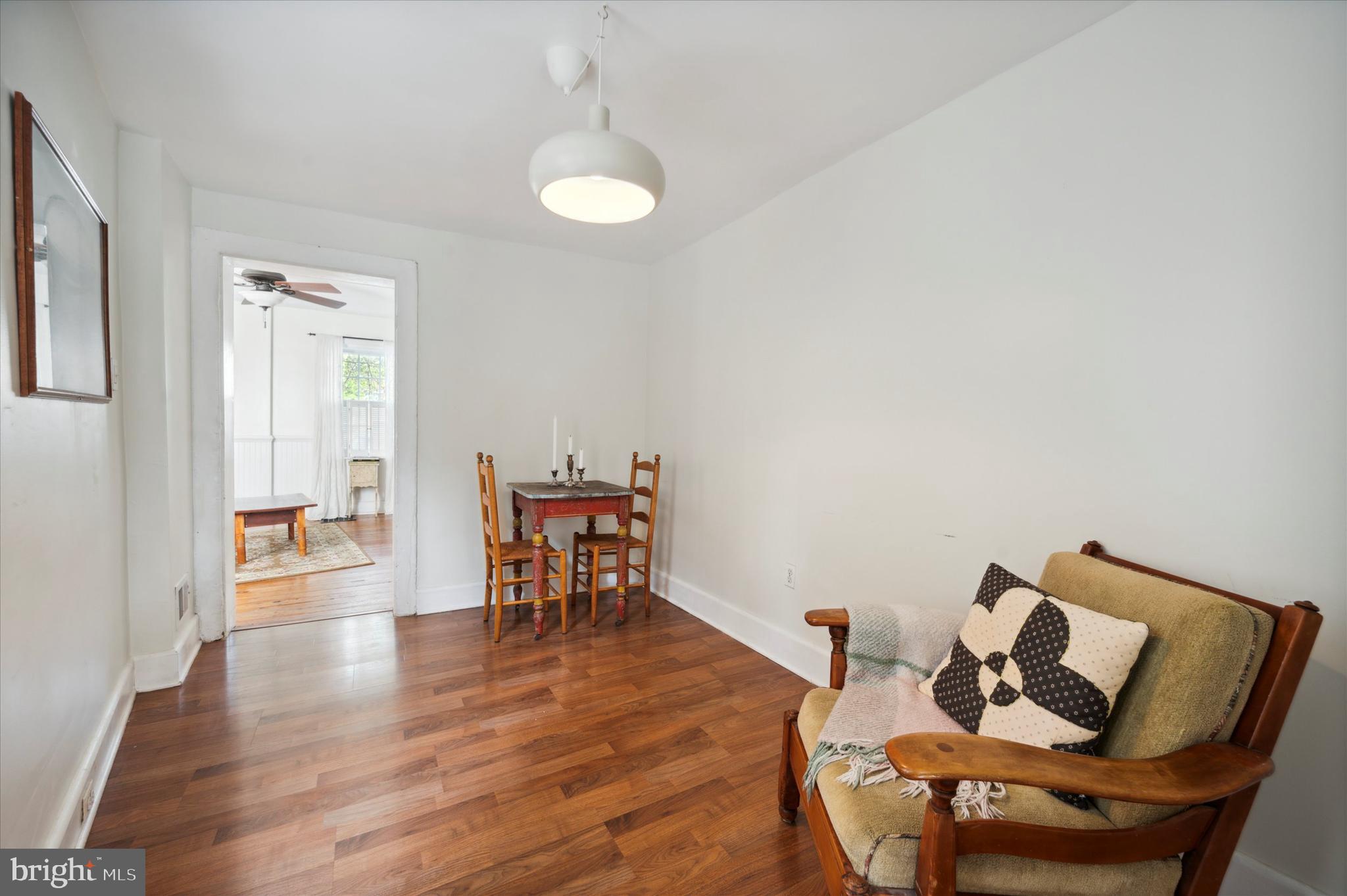 1125 East Moyamensing Avenue Philadelphia, PA 19147 - Photo 11 of 25 a dining room with furniture and wooden floor