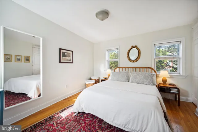 a bedroom with bed and a window