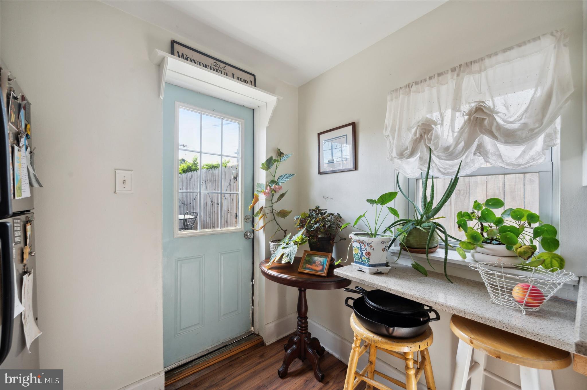 1125 East Moyamensing Avenue Philadelphia, PA 19147 - Photo 25 of 25 a table with a potted plant and a window