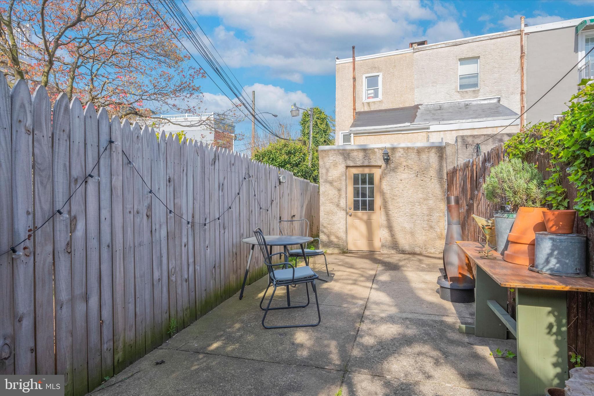 1125 East Moyamensing Avenue Philadelphia, PA 19147 - Photo 3 of 25 a wooden bench sitting in backside of a building