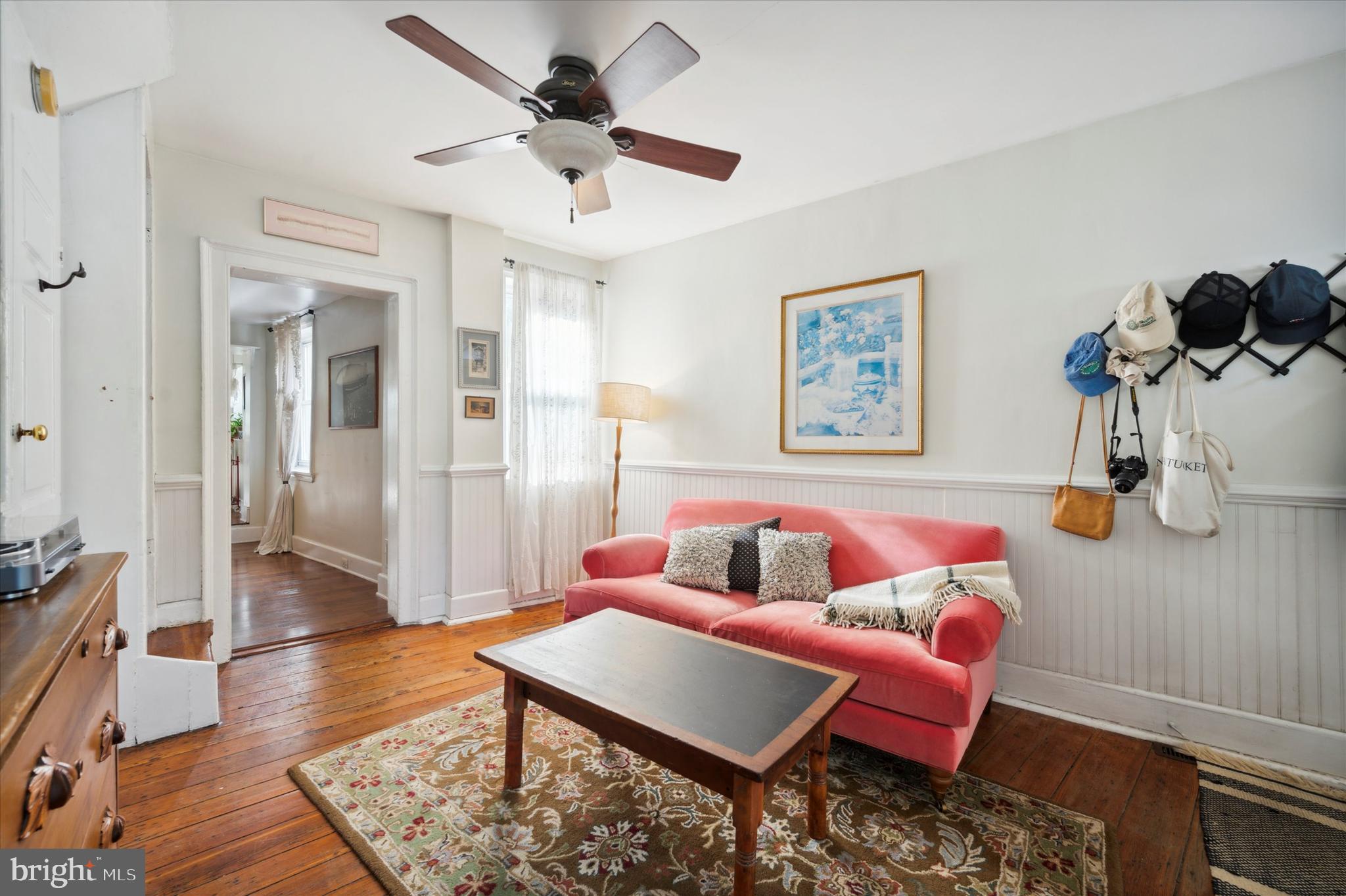 1125 East Moyamensing Avenue Philadelphia, PA 19147 - Photo 5 of 25 a living room with furniture and a wooden floor