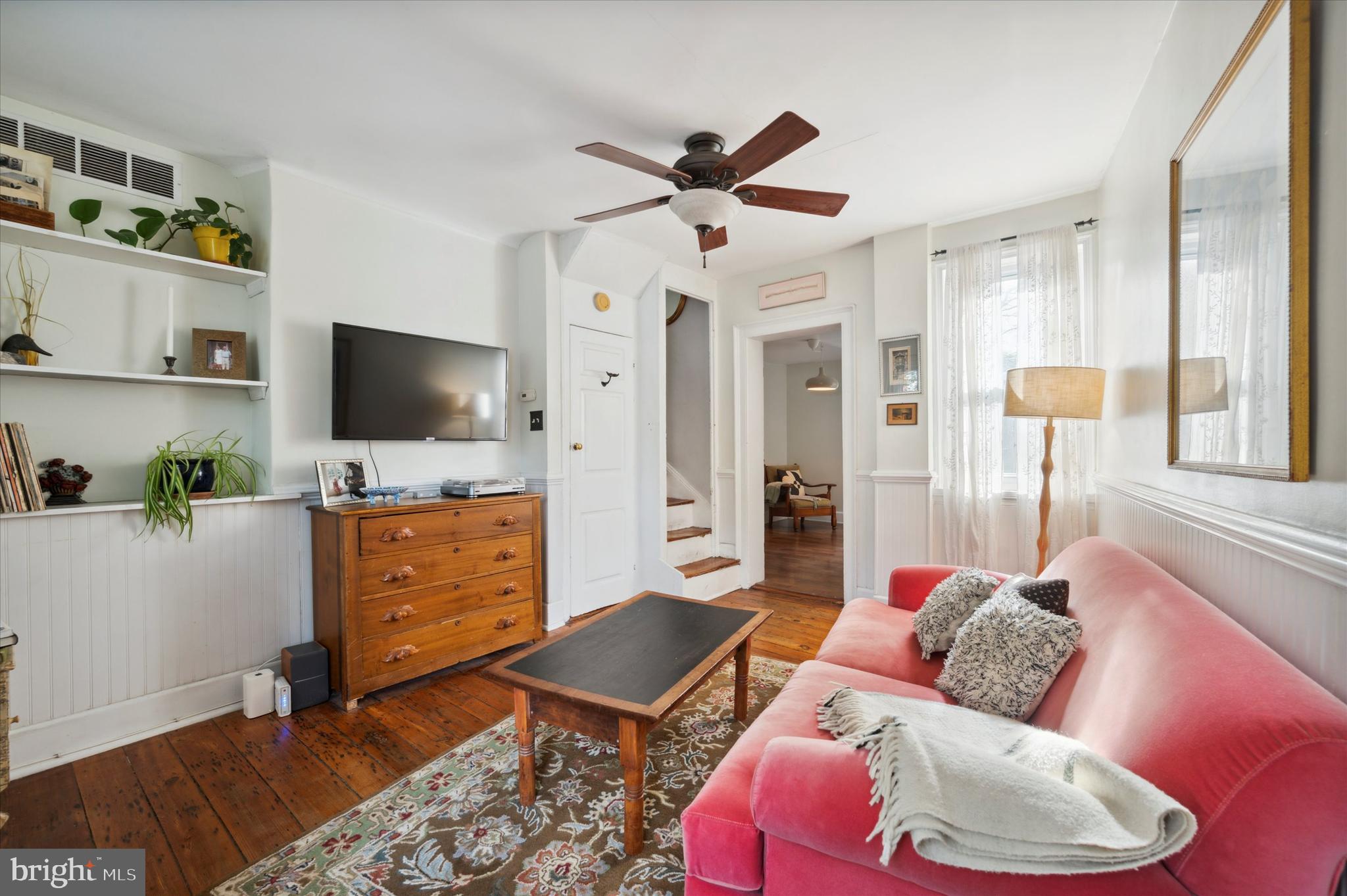 1125 East Moyamensing Avenue Philadelphia, PA 19147 - Photo 6 of 25 a living room with furniture and a flat screen tv