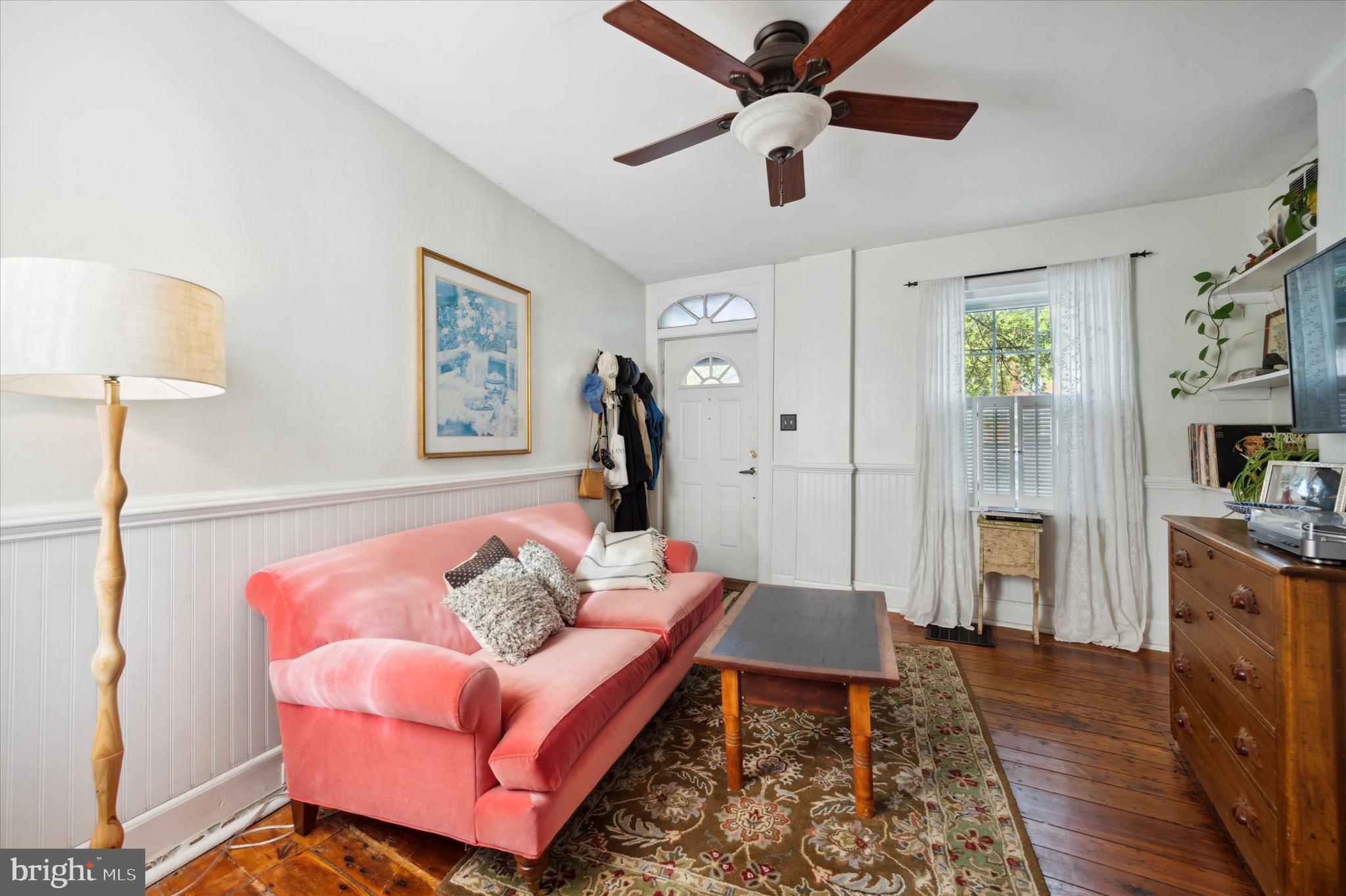 1125 East Moyamensing Avenue Philadelphia, PA 19147 - Photo 7 of 25 a living room with furniture and a rug