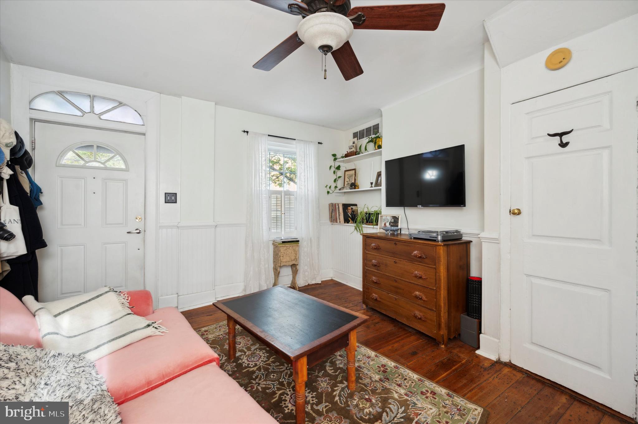 1125 East Moyamensing Avenue Philadelphia, PA 19147 - Photo 8 of 25 a living room with furniture and a flat screen tv