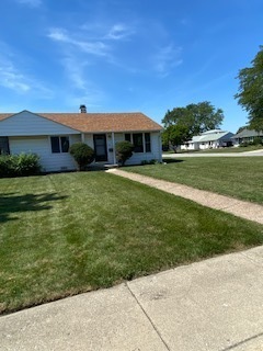 8732 South Corcoran Road, Unit 8732 Hometown, IL 60456 - Photo 1 of 22 a front view of a house with garden