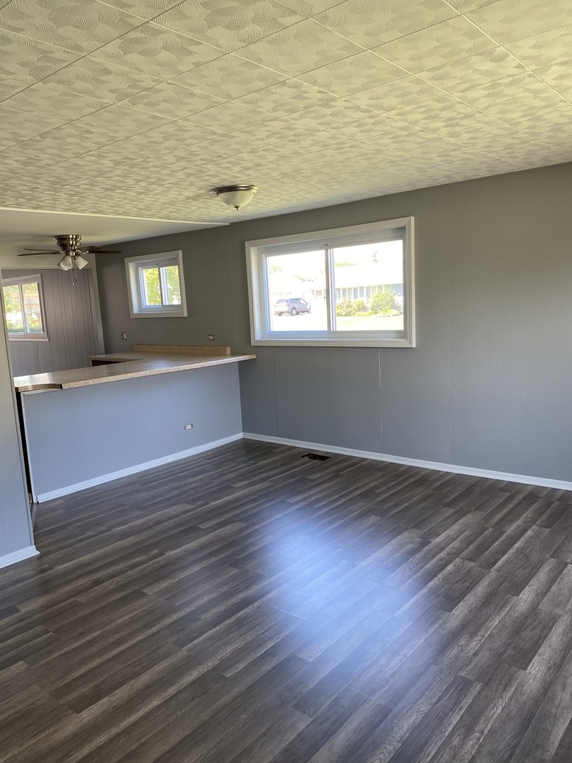 8732 South Corcoran Road, Unit 8732 Hometown, IL 60456 - Photo 8 of 22 a view of a livingroom with wooden floor