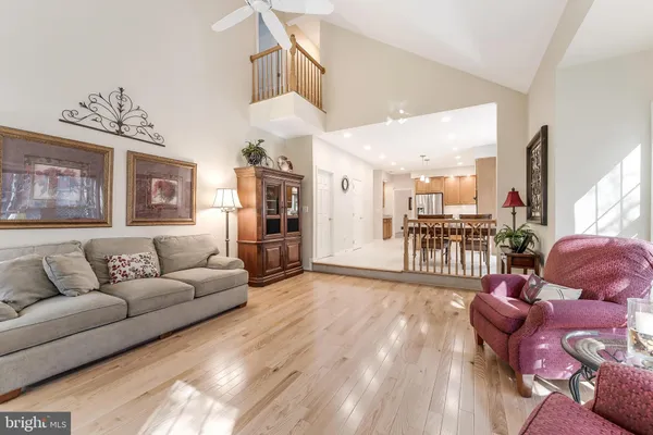 a kitchen with stainless steel appliances granite countertop a refrigerator a stove a sink and a refrigerator