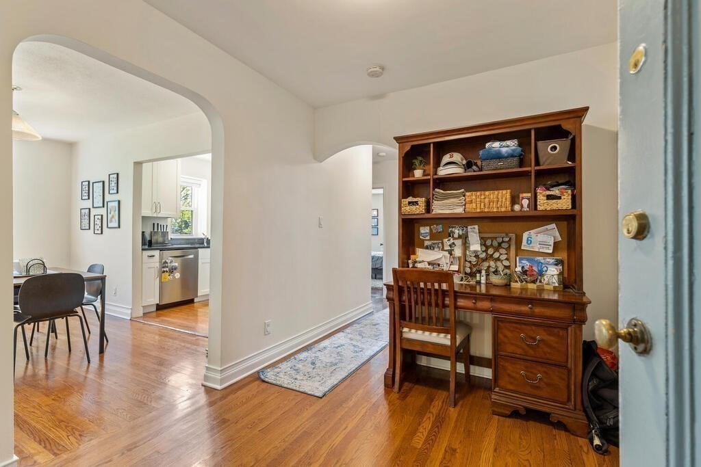 395 Broadway, Unit R5E Cambridge, MA 02139 - Photo 15 of 27 a dining room with furniture and wooden floor