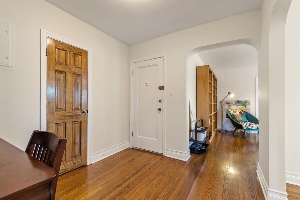 395 Broadway, Unit R5E Cambridge, MA 02139 - Photo 16 of 27 a view of livingroom with furniture and wooden floor