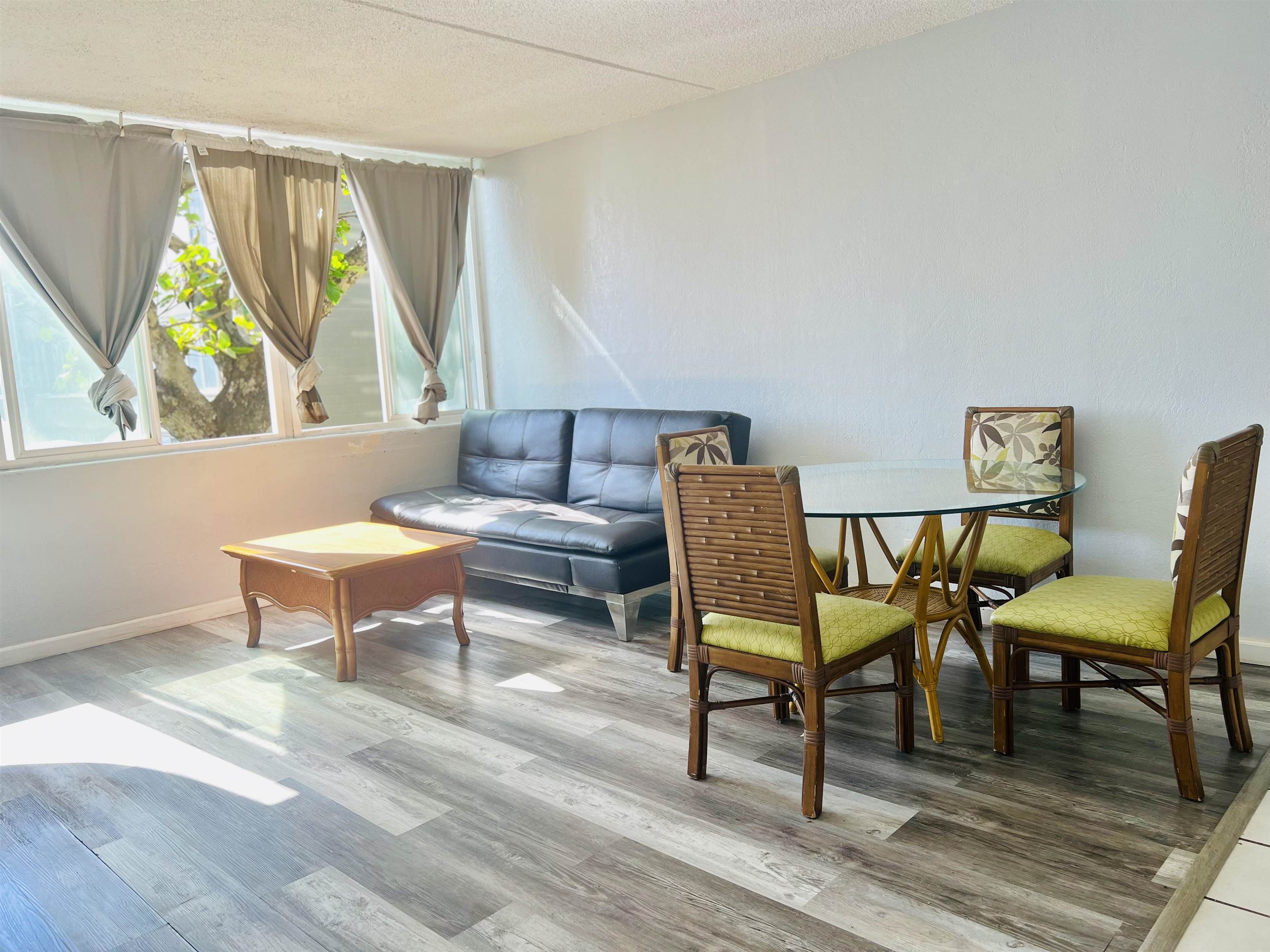 111 Kahului Beach Road, Unit D225 Kahului, HI 96732 - Photo 2 of 31 a living room with furniture and a wooden floor