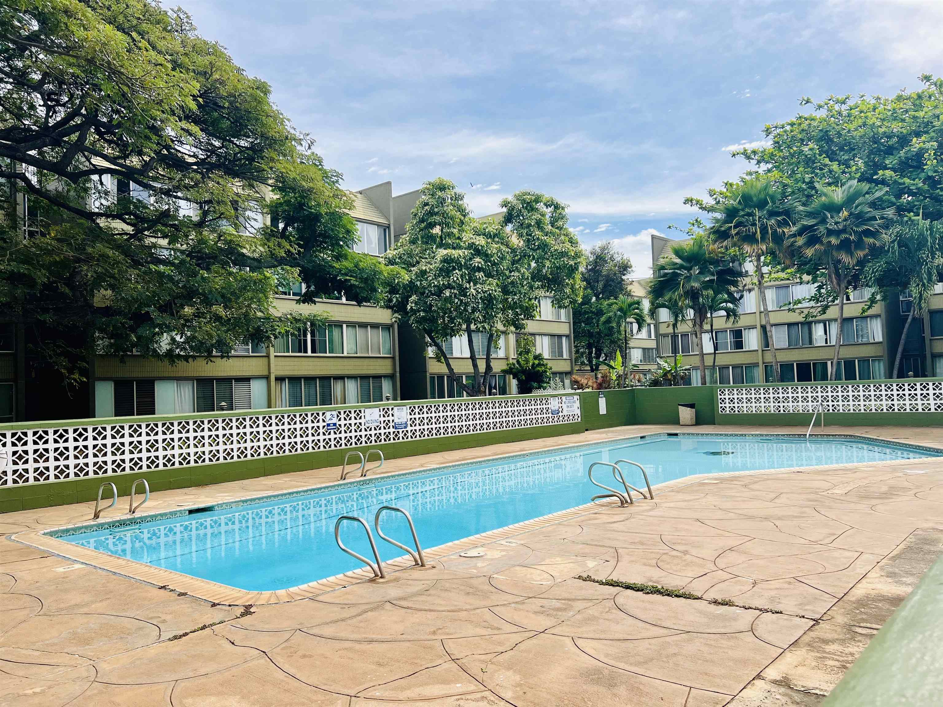 111 Kahului Beach Road, Unit D225 Kahului, HI 96732 - Photo 27 of 31 front view of a house with a swimming pool and a big yard